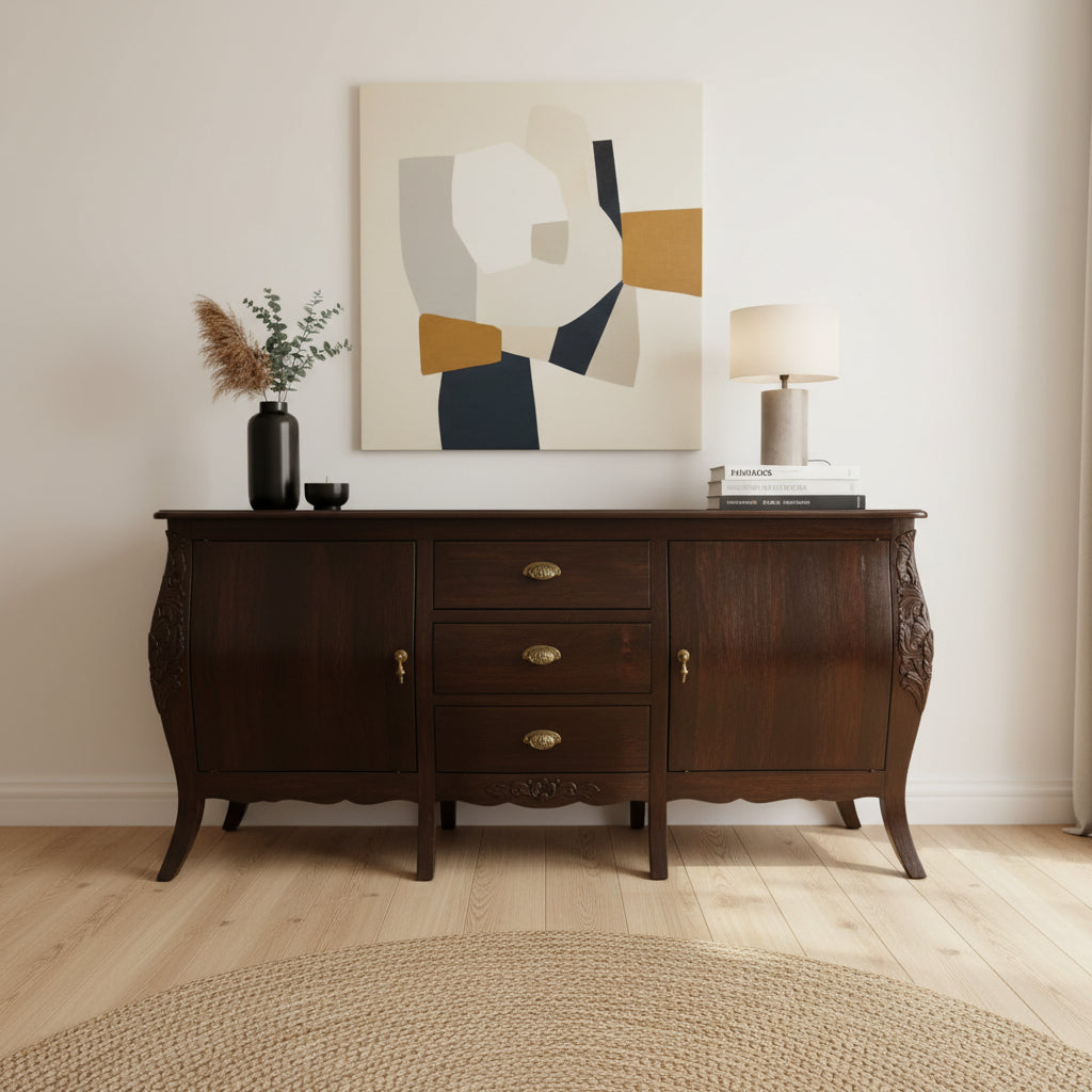Elegant dark wood sideboard featuring three central drawers, two cabinet doors, brass hardware, curved legs, and subtle carved detailing for a sophisticated classic look.