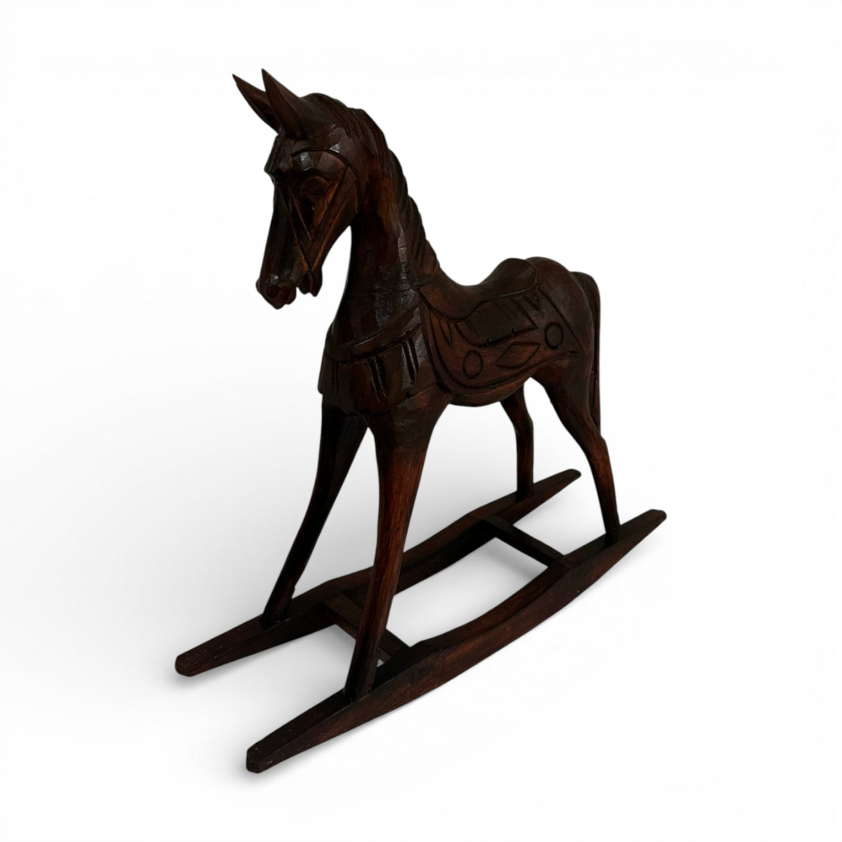 Hand-carved dark wood rocking horse sculpture featuring intricate artisan detailing and a rich polished finish, perfect as a timeless decorative accent for consoles, shelves, coffee tables, or classic and contemporary interiors.