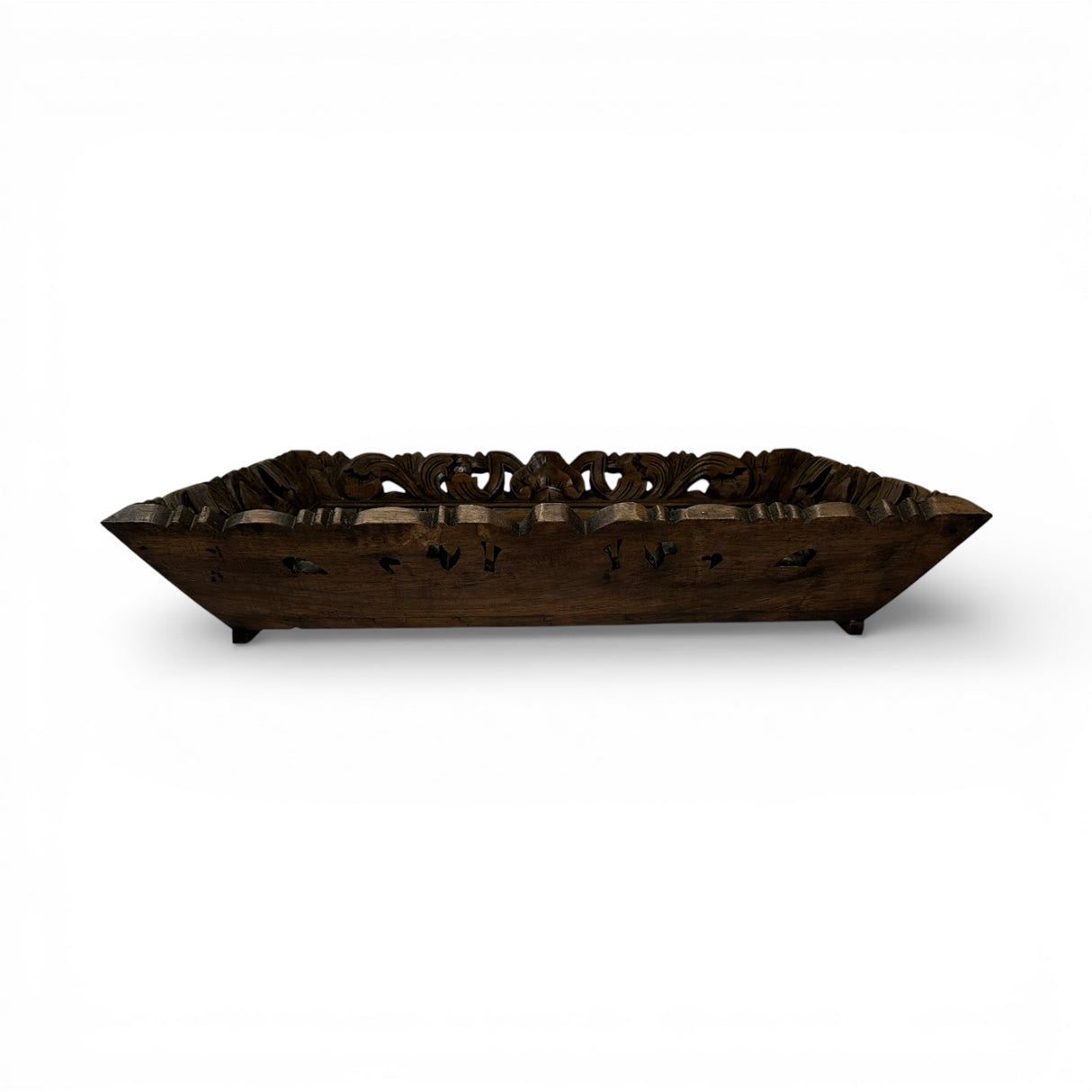 Hand-carved rectangular wooden display tray in a dark walnut finish with intricate floral openwork detailing and raised edges. A sophisticated decorative tray ideal for styling candles, books, vases, or serving as a timeless centerpiece on a coffee table or console.
