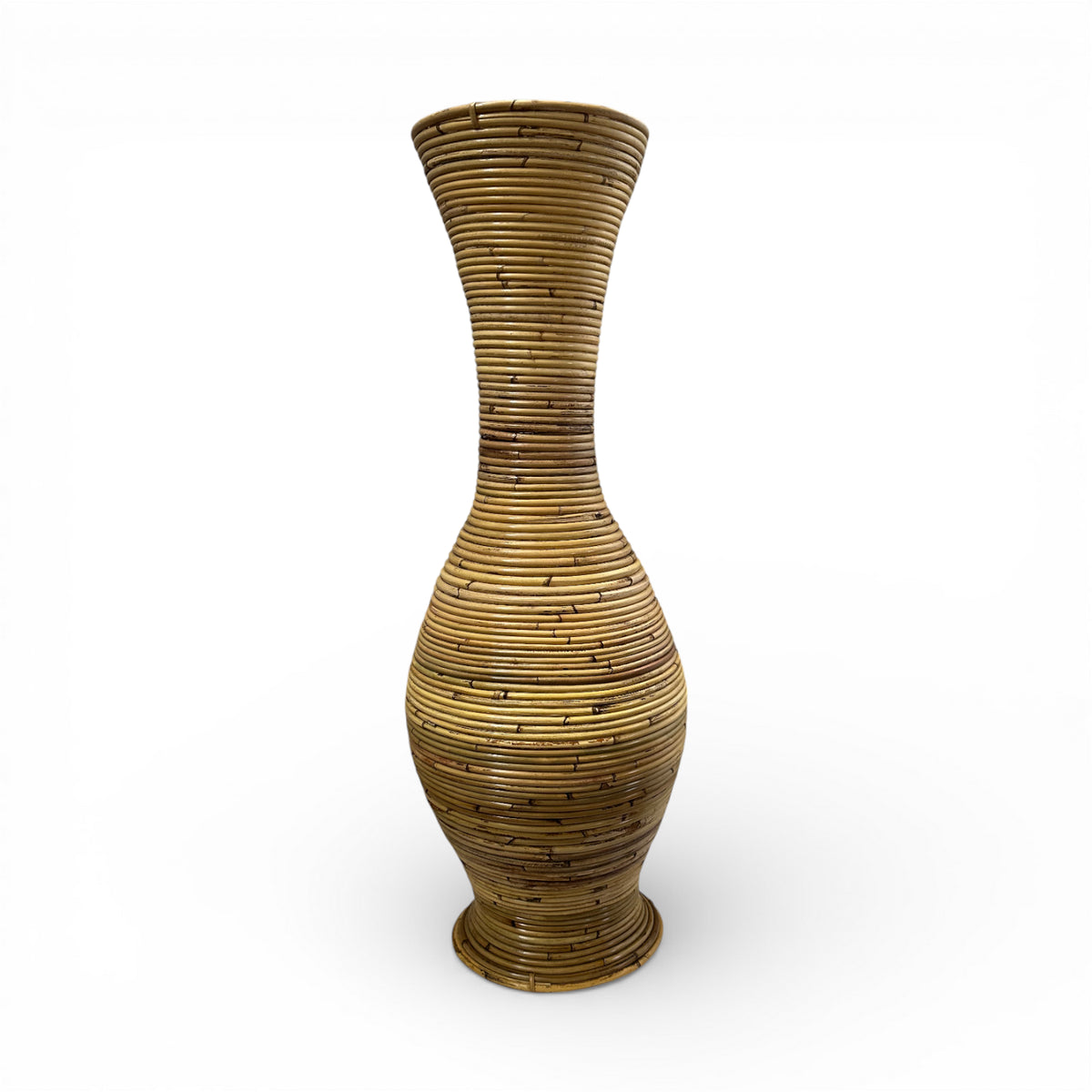 Handwoven natural floor vase with a tall sculptural hourglass silhouette, rounded body, and richly textured woven finish, perfect for displaying decorative branches, pampas grass, or dried botanicals while adding warm organic texture and timeless artisanal elegance to contemporary, coastal, and rustic interiors.