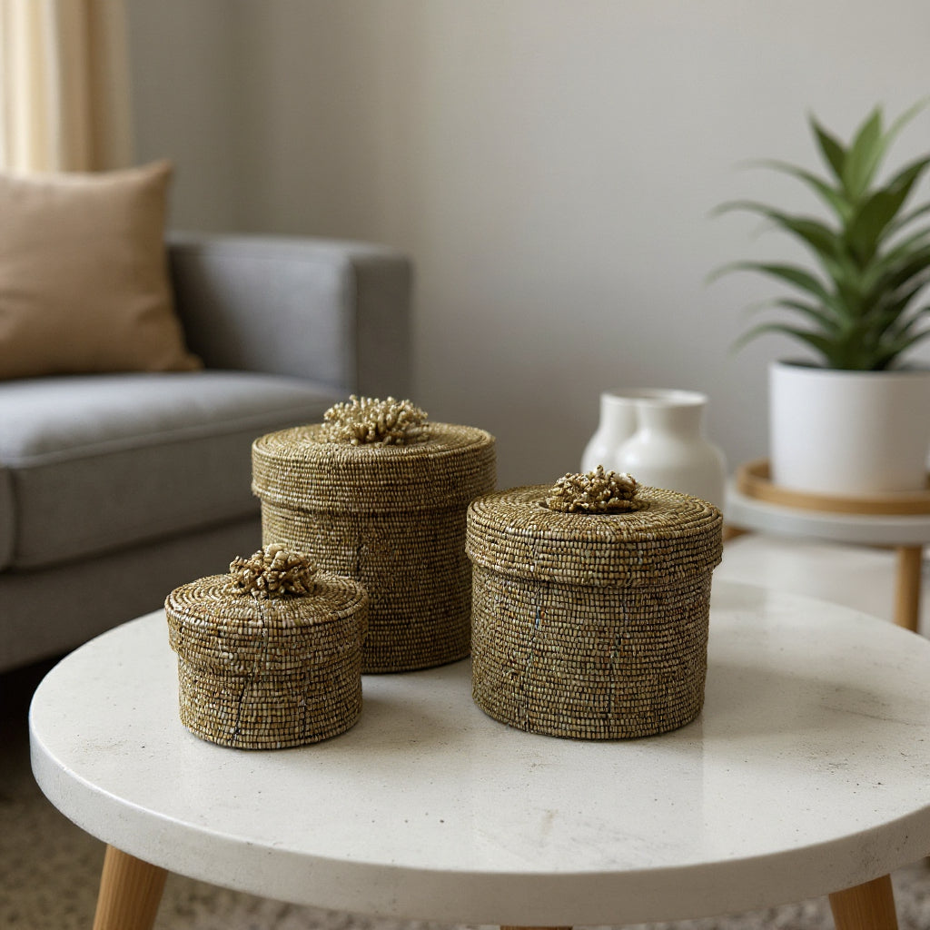 Set of handcrafted cylindrical storage baskets with natural wooden beads, matching fitted lids, and decorative beaded handles, styled on a modern coffee table to add elegant storage and warm organic texture to contemporary living spaces.