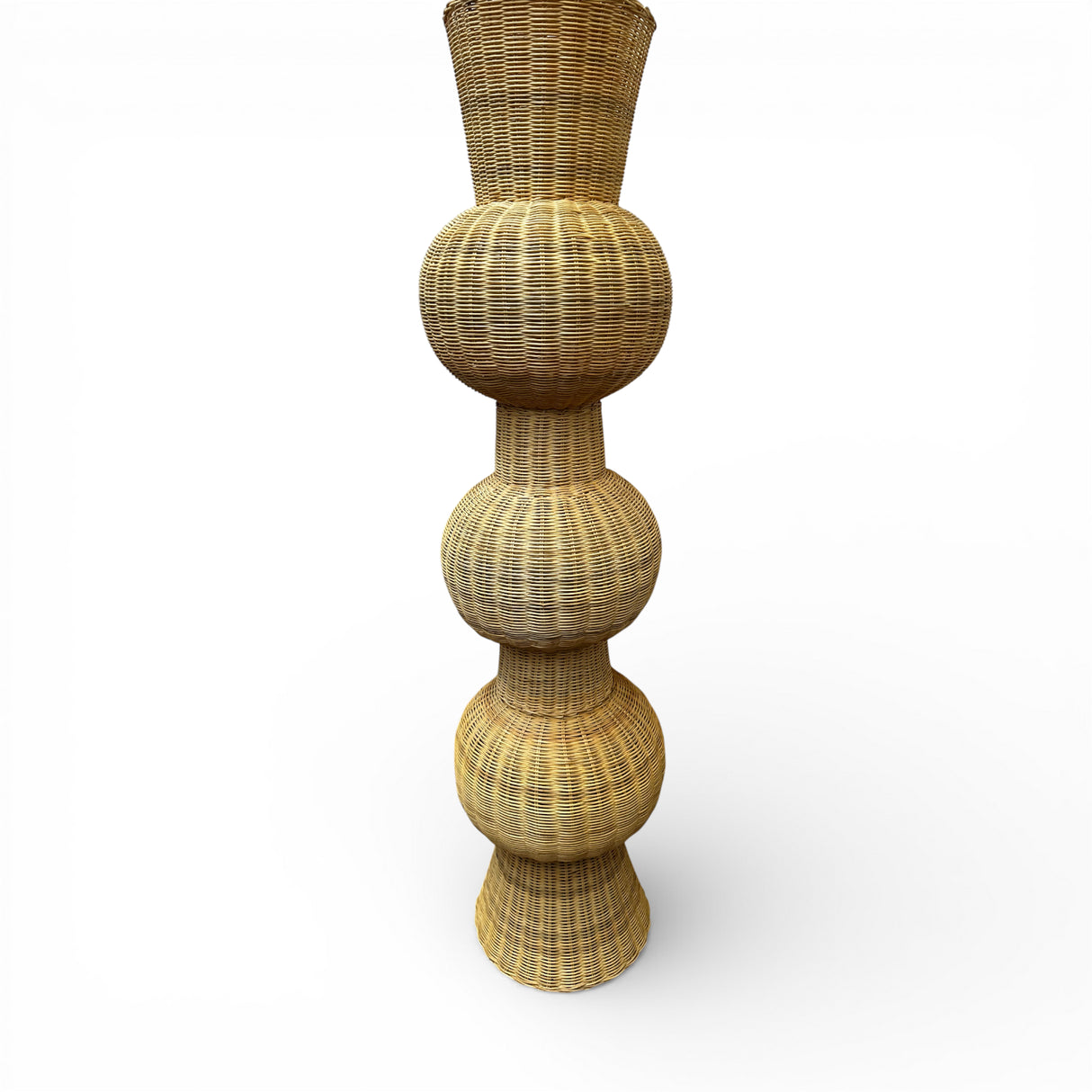 Tall handwoven sculptural floor vase featuring a natural wicker finish and a striking stacked bulb silhouette. A statement décor piece perfect for styling entryways, living rooms, covered patios, boutique hotels, or contemporary interiors.