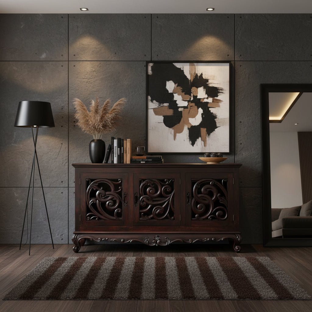 Elegant dark wood sideboard featuring three cabinet doors with intricate carved scrollwork, decorative detailing, and curved feet, styled in a sophisticated interior.