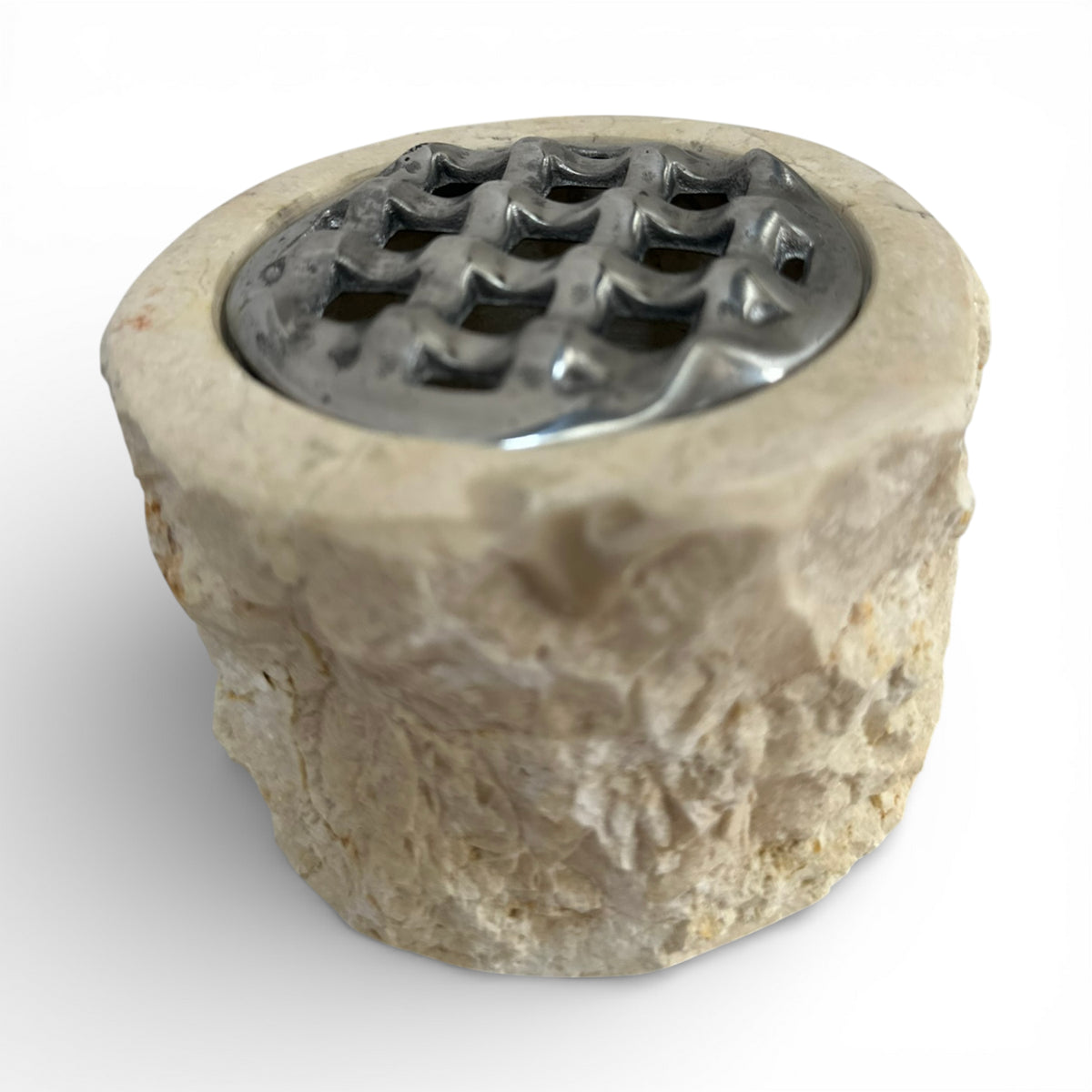 Decorative rustic beige marble potpourri bowl crafted from natural stone with a hand-textured exterior and a silver metal lattice lid. A unique statement décor piece that brings organic character and timeless elegance to coffee tables, consoles, shelves, bathrooms, and luxury living spaces.