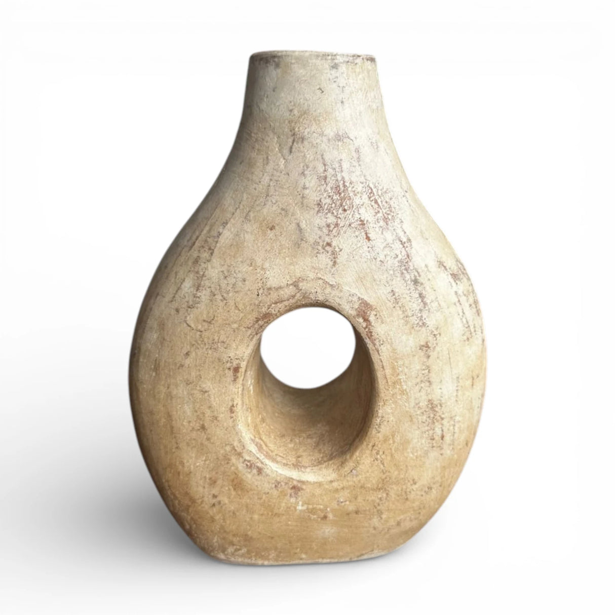 Rustic terracotta donut vase featuring a sculptural circular cut-out, rounded silhouette, and weathered natural finish. A handcrafted statement décor piece perfect for dried botanicals, shelves, consoles, and coffee tables in modern, boho, Mediterranean, wabi-sabi, and contemporary interiors.