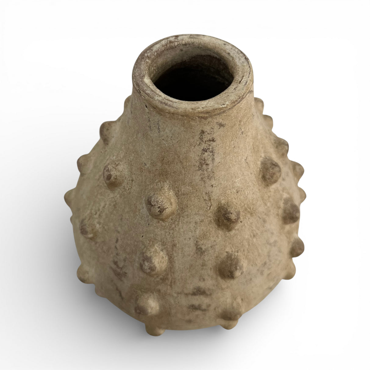 Textured stoneware vase in a natural sand finish with a rounded silhouette, raised bobble detailing, and a narrow neck. A sculptural decorative accent that adds organic texture and contemporary style to shelves, consoles, coffee tables, or styled displays.