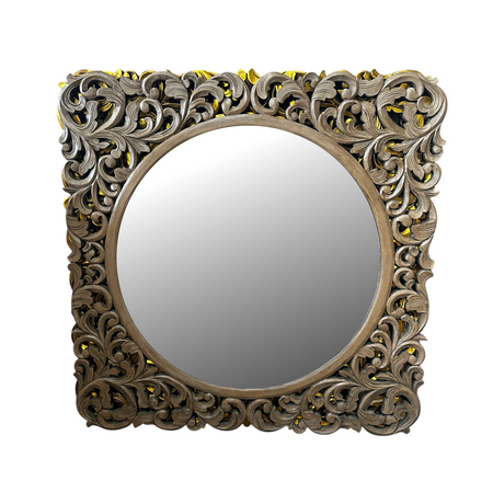 Antique grey carved wooden wall mirror featuring an intricately hand-carved botanical frame with a distressed weathered finish and round mirror centre. This elegant statement mirror adds timeless character to entryways, living rooms, bedrooms, and hallways while complementing rustic, farmhouse, traditional, contemporary, and luxury interiors.