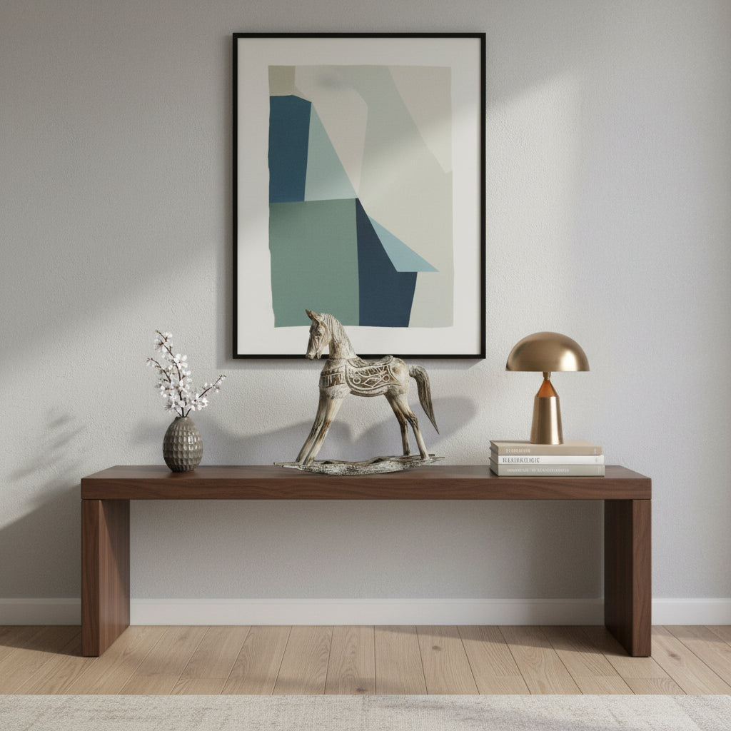 Decorative antique silver horse sculpture featuring intricate carved detailing and a distressed metallic finish, styled on a modern console table to add timeless elegance and equestrian charm to contemporary interiors.