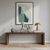 Decorative antique silver horse sculpture featuring intricate carved detailing and a distressed metallic finish, styled on a modern console table to add timeless elegance and equestrian charm to contemporary interiors.