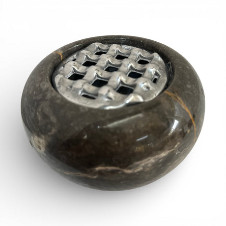 Elegant black marble potpourri bowl featuring a polished natural stone finish with subtle gold veining and a decorative silver metal lattice lid. A sophisticated home décor accessory ideal for coffee tables, consoles, bathrooms, or luxury living spaces.