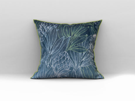 Decorative blue scatter cushion featuring an elegant protea and botanical leaf pattern with contrasting green piping, perfect for adding colour and texture to stylish interiors.