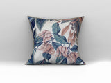 Decorative scatter cushion featuring soft blush florals and deep blue botanical leaves on a neutral background, perfect for adding elegant colour and pattern to stylish interiors.