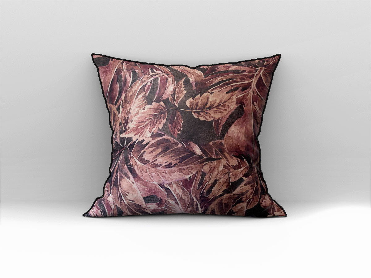 Decorative scatter cushion featuring a rich burgundy and dusty rose botanical leaf pattern with dark piping, perfect for adding warmth and sophisticated pattern to stylish interiors.