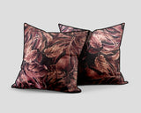 Set of three decorative scatter cushions featuring a rich burgundy, dusty rose, and brown botanical leaf pattern with dark piping, ideal for adding warmth and sophisticated texture to interiors.