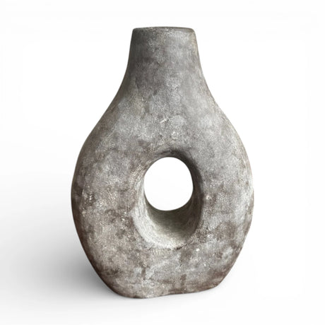 Charcoal donut decorative vase featuring a sculptural circular cut-out, rounded organic silhouette, and textured stone-effect finish. A modern statement décor piece ideal for dried botanicals, shelves, consoles, coffee tables, and Scandinavian, wabi-sabi, industrial, or contemporary home interiors.