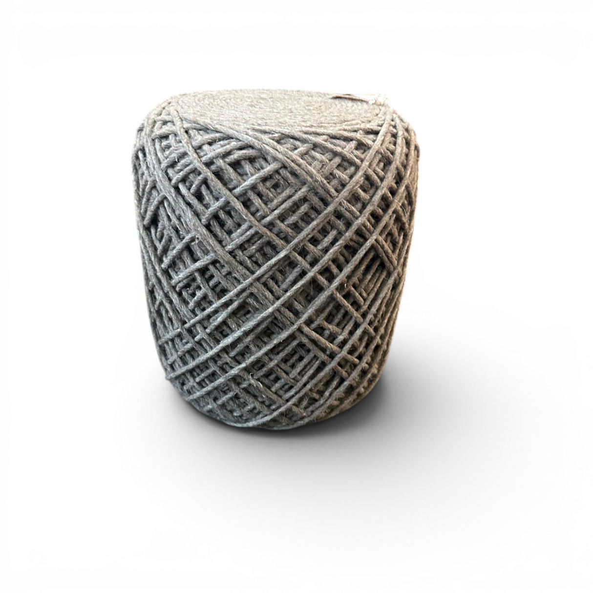 Round charcoal handwoven knit pouffe with a textured woven pattern, ideal as a footrest, extra seat, or decorative accent in modern living spaces.