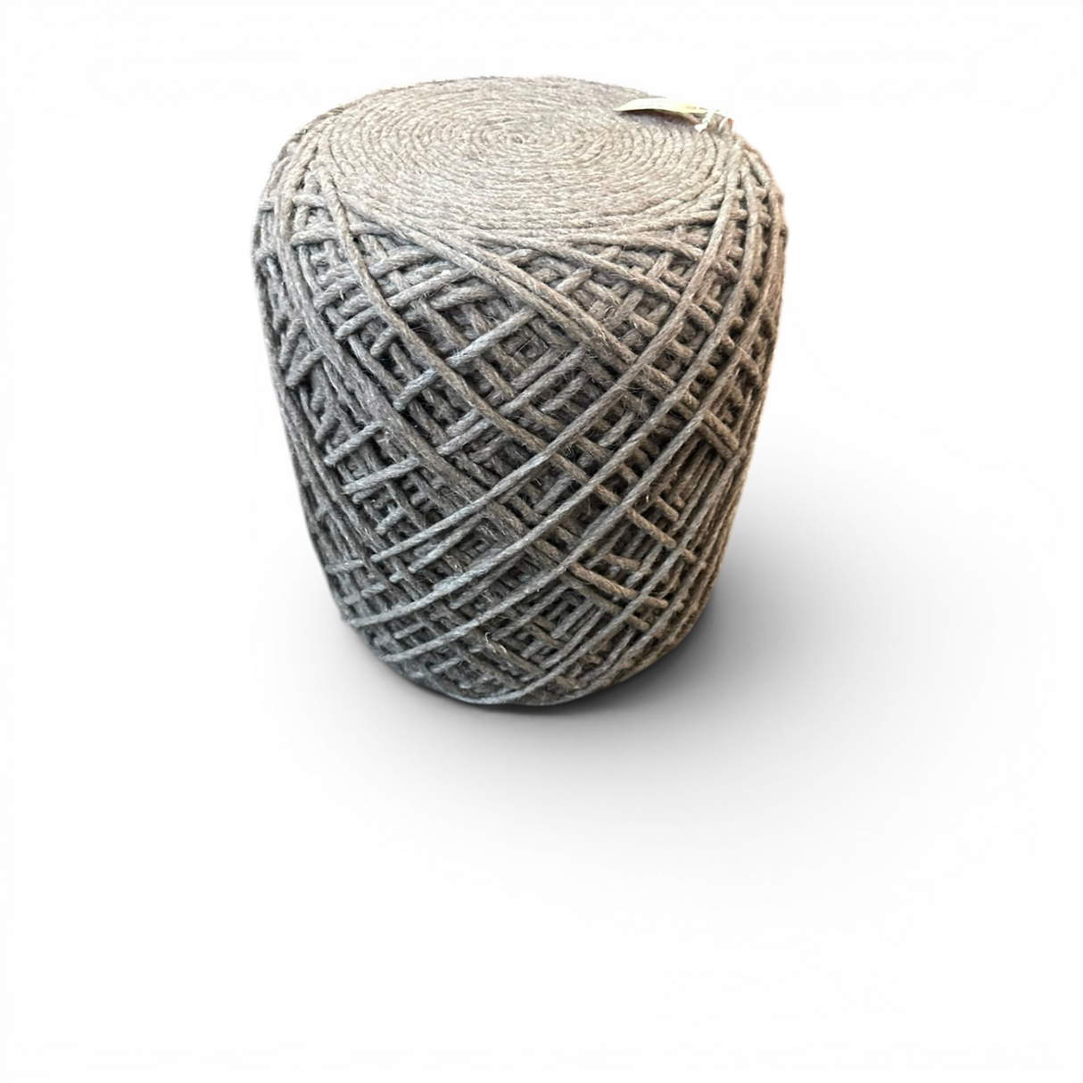 Round charcoal handwoven knit pouffe with a textured woven pattern, ideal as a footrest, extra seat, or decorative accent in modern living spaces.
