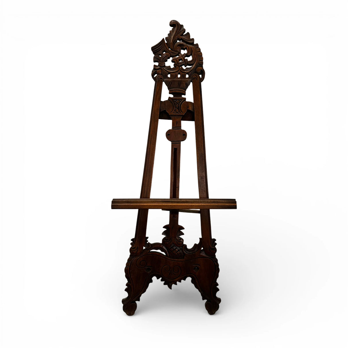 Traditional carved wooden display easel in a rich dark wood finish, featuring intricate ornamental detailing and an adjustable support, perfect for displaying artwork, mirrors, wedding signage, menus, or decorative pieces.