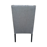 Modern high-back dining chair upholstered in textured grey fabric with contrasting patterned seat and backrest panels. Featuring gently curved wingback sides and sleek dark wooden legs, this elegant chair is ideal for dining rooms, restaurants, boutique hotels, or contemporary interiors.
