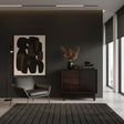 Elegant dark wood sideboard featuring integrated drawers, a sleek cabinet door, and short wooden legs, styled in a sophisticated modern interior.