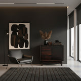 Elegant dark wood sideboard featuring integrated drawers, a sleek cabinet door, and short wooden legs, styled in a sophisticated modern interior.