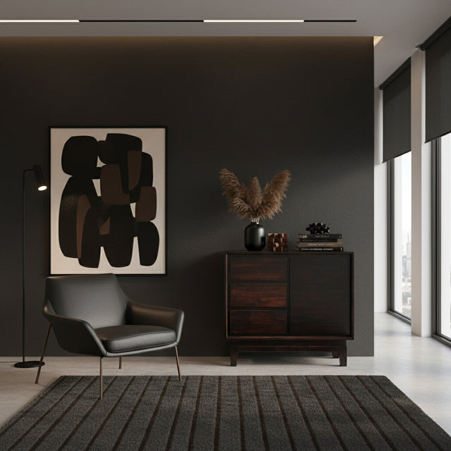 Elegant dark wood sideboard featuring integrated drawers, a sleek cabinet door, and short wooden legs, styled in a sophisticated modern interior.
