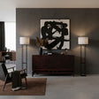 Elegant dark wood sideboard featuring geometric line detailing across the cabinet fronts, a raised base, and tapered wooden legs, styled in a sophisticated contemporary interior.