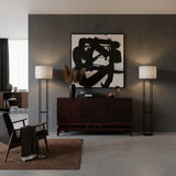 Elegant dark wood sideboard featuring geometric line detailing across the cabinet fronts, a raised base, and tapered wooden legs, styled in a sophisticated contemporary interior.