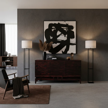 Elegant dark wood sideboard featuring geometric line detailing across the cabinet fronts, a raised base, and tapered wooden legs, styled in a sophisticated contemporary interior.
