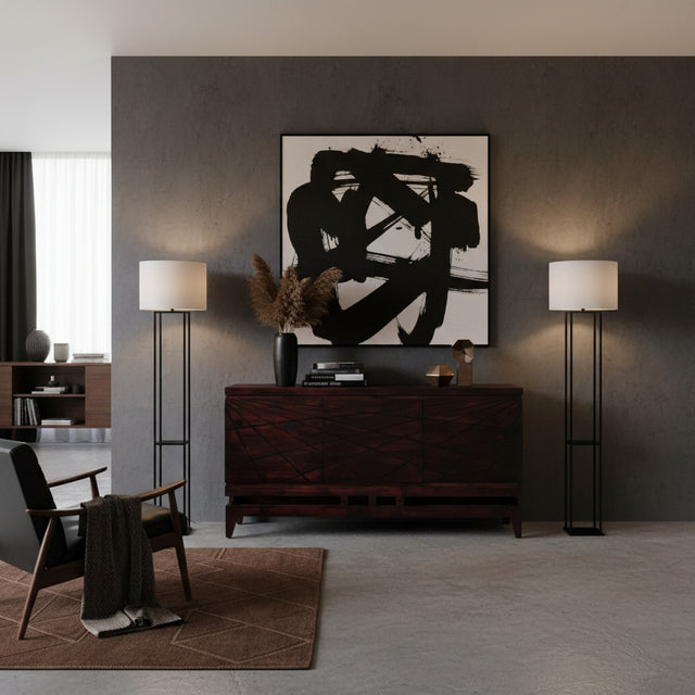 Elegant dark wood sideboard featuring geometric line detailing across the cabinet fronts, a raised base, and tapered wooden legs, styled in a sophisticated contemporary interior.