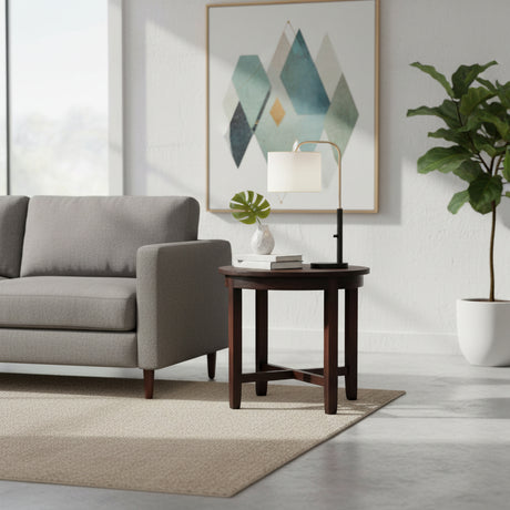 Modern living room with gray sofa, wooden side table, and decorative elements.