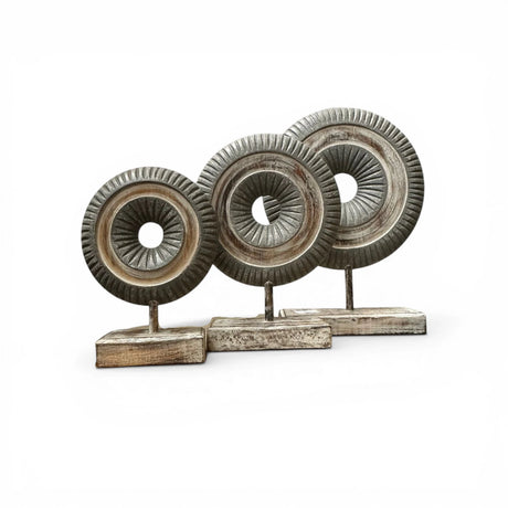 Set of three decorative carved wooden ring sculptures mounted on matching stands, featuring intricate radial detailing in distressed grey and natural wood finishes. These contemporary tabletop accents add texture and visual interest to consoles, shelves, coffee tables, and modern, Scandinavian, rustic, or minimalist interiors.