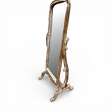 Distressed whitewashed freestanding cheval floor mirror featuring an elegant arched wooden frame, decorative carved support legs, and an adjustable tilt mechanism. This full-length statement mirror adds vintage charm to bedrooms, dressing rooms, walk-in wardrobes, and living spaces while complementing farmhouse, French country, coastal, rustic, and luxury interiors.