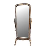 Distressed whitewashed freestanding cheval floor mirror featuring a gracefully arched wooden frame, decorative carved base, and adjustable tilt mechanism. This elegant full-length dressing mirror brings timeless vintage charm to bedrooms, dressing rooms, walk-in wardrobes, and living spaces while complementing farmhouse, French country, coastal, rustic, and luxury interiors.