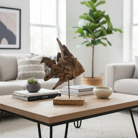 Handcrafted driftwood fish sculpture mounted on a sleek metal stand with a solid wooden base. Made from reclaimed natural wood with a weathered finish, this coastal-inspired decorative accent adds organic texture and artisan charm to coffee tables, consoles, shelves, and contemporary living spaces.