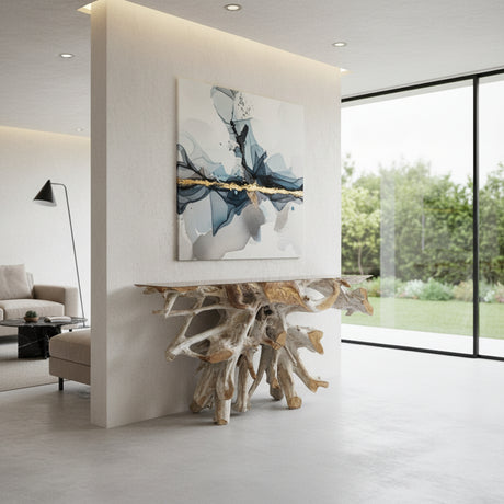 Handcrafted driftwood root console table featuring a sculptural natural wood root base with a rectangular tabletop, styled beneath modern wall art in a contemporary living space.