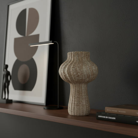 Fluted stoneware sculptural vase with a textured natural finish, featuring a rounded bulb-shaped body, narrow neck, and vertical ribbed detailing. A contemporary decorative vase that adds organic texture and timeless elegance to shelves, consoles, or coffee tables.