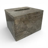Elegant square tissue box cover crafted from grey marble with natural veining and a polished finish. Features a discreet top opening for tissues, making it a sophisticated accessory for bathrooms, bedrooms, living rooms, or office spaces.