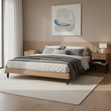 Modern bedroom with wooden bed, nightstands, and abstract art on the wall.