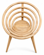 Contemporary solid teak accent chair featuring a sculptural concentric circular backrest, natural wood finish, and tapered legs. A striking statement chair for modern, luxury, and organic-inspired living spaces.