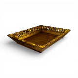 Hand-carved square decorative tray in a rich gold finish with intricate floral-inspired detailing along the edges. A luxurious statement piece ideal for styling candles, vases, or decorative accessories on a coffee table, console, or ottoman.
