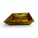 Hand-carved square decorative tray in a rich gold finish with intricate floral-inspired detailing along the edges. A luxurious statement piece ideal for styling candles, vases, or decorative accessories on a coffee table, console, or ottoman.