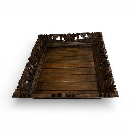 Hand-carved square wooden decorative tray in a dark walnut finish with intricate openwork detailing and raised edges. A timeless accent piece perfect for styling candles, books, vases, or serving as an elegant coffee table or console display.