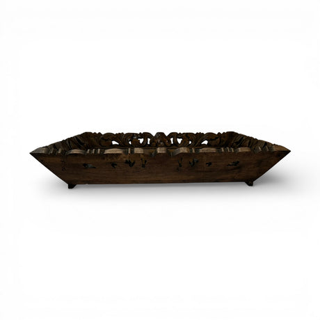 Hand-carved rectangular wooden display tray in a dark walnut finish with intricate floral openwork detailing and raised edges. A sophisticated decorative tray ideal for styling candles, books, vases, or serving as a timeless centerpiece on a coffee table or console.