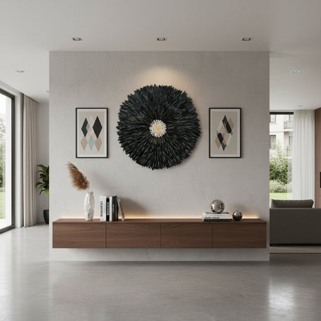 Round handcrafted Juju wall décor featuring layered black feathers with a contrasting white centre, creating a bold and luxurious statement piece. Perfect for living rooms, bedrooms, entryways, boutique hotels, or contemporary interiors seeking dramatic texture and elegance.