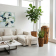 Handcrafted live edge wooden planter pedestals made from solid natural timber, featuring rich organic wood grain and sculptural forms, styled with indoor plants in a bright contemporary living room.