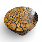 Round handcrafted tabletop featuring natural wood log slices arranged in a unique mosaic pattern with a smooth polished finish. Showcasing the organic grain and character of each piece, it creates a warm rustic focal point for dining rooms, lodges, cafés, or nature-inspired interiors.