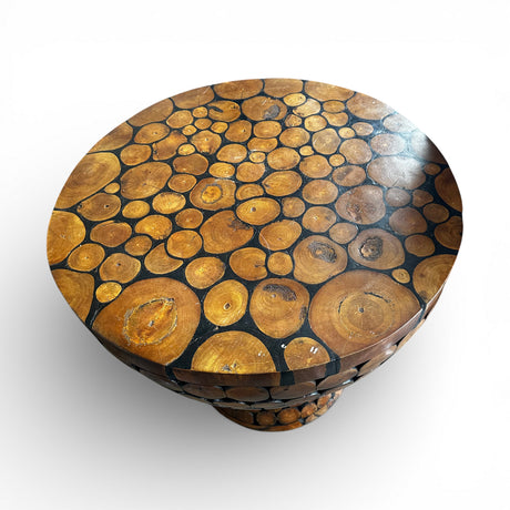 Round handcrafted tabletop featuring natural wood log slices arranged in a unique mosaic pattern with a smooth polished finish. Showcasing the organic grain and character of each piece, it creates a warm rustic focal point for dining rooms, lodges, cafés, or nature-inspired interiors.