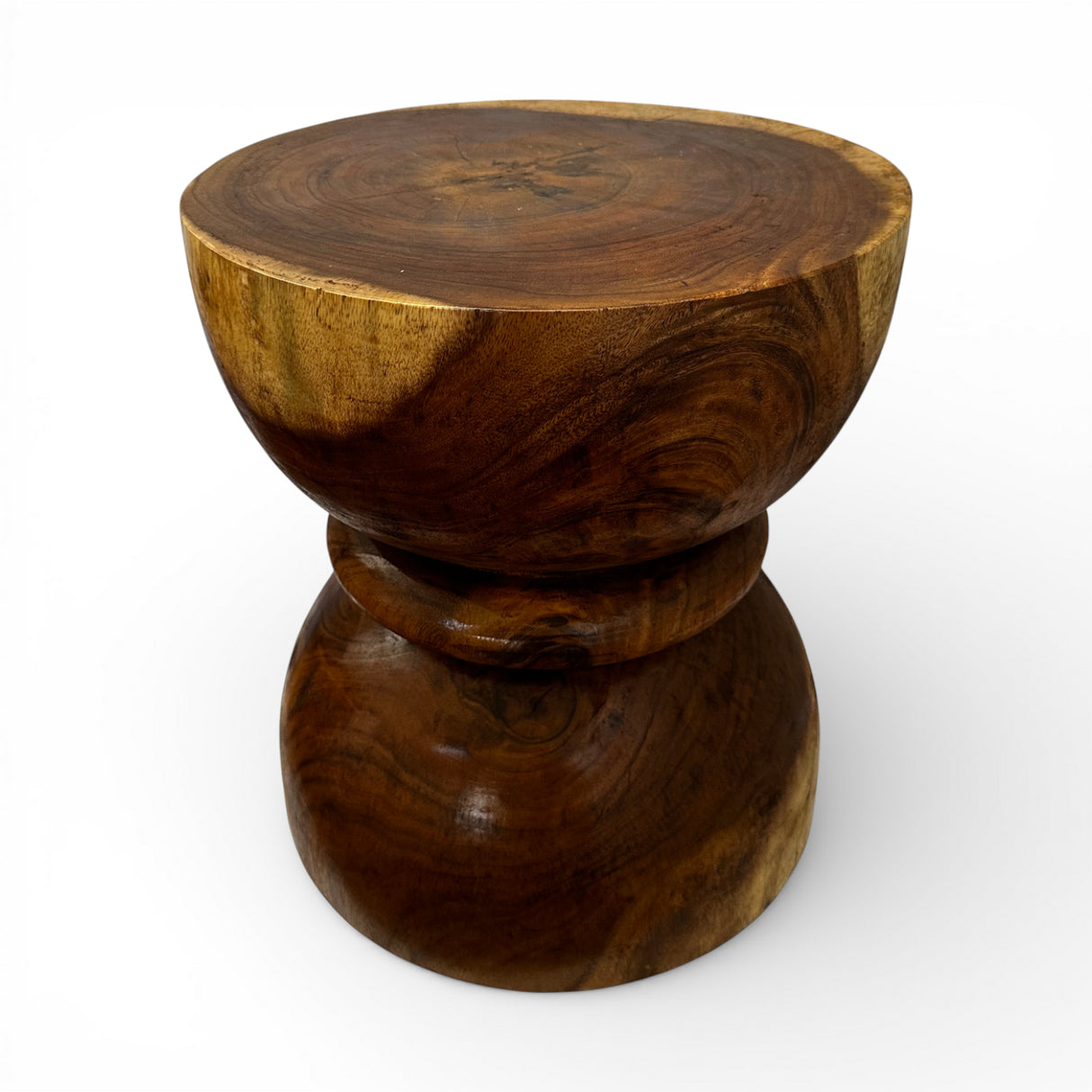 Handcrafted sculptural side table crafted from solid teak wood, featuring a smooth rounded tabletop and an elegant hourglass pedestal base that highlights the rich natural wood grain. A timeless statement piece perfect for living rooms, bedrooms, boutique hotels, lodges, or contemporary luxury interiors.