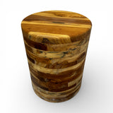Handcrafted round accent table crafted from solid teak wood, featuring a clean cylindrical silhouette with a smooth polished top that showcases the rich natural grain and warm timber tones. A timeless statement piece perfect as a side table, bedside table, or decorative accent for living rooms, bedrooms, boutique hotels, lodges, or contemporary rustic interiors.
